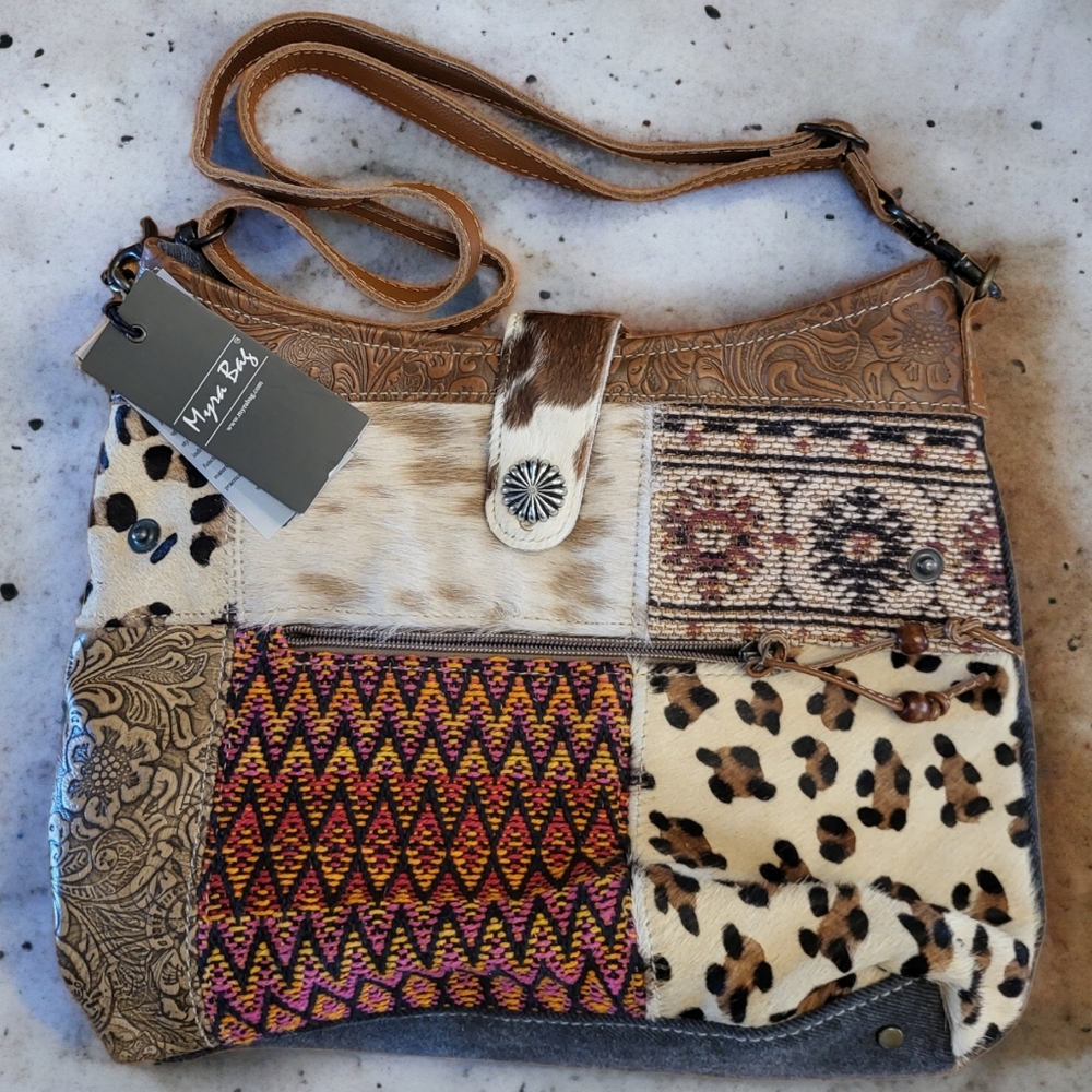 Myra Bag hand woven rug with fur on hide